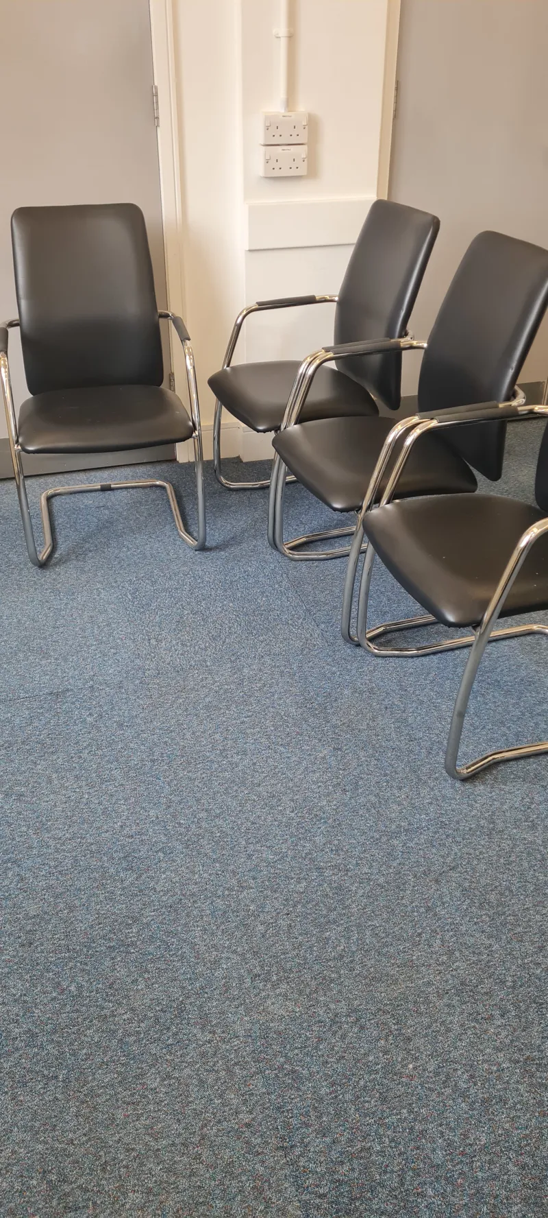 Four meeting room chairs