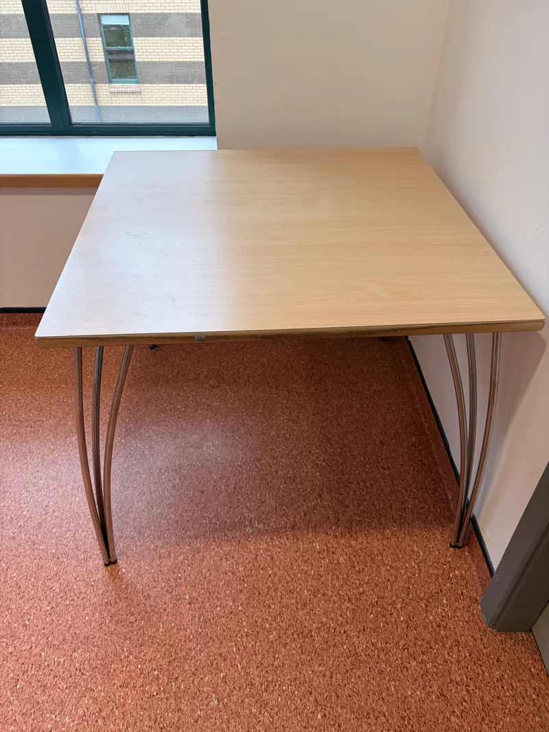 Wooden table with metal legs