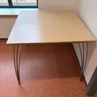 Wooden table with metal legs